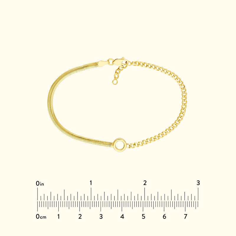Gold bracelet featuring a mix of textured and smooth chains, with a circular clasp.