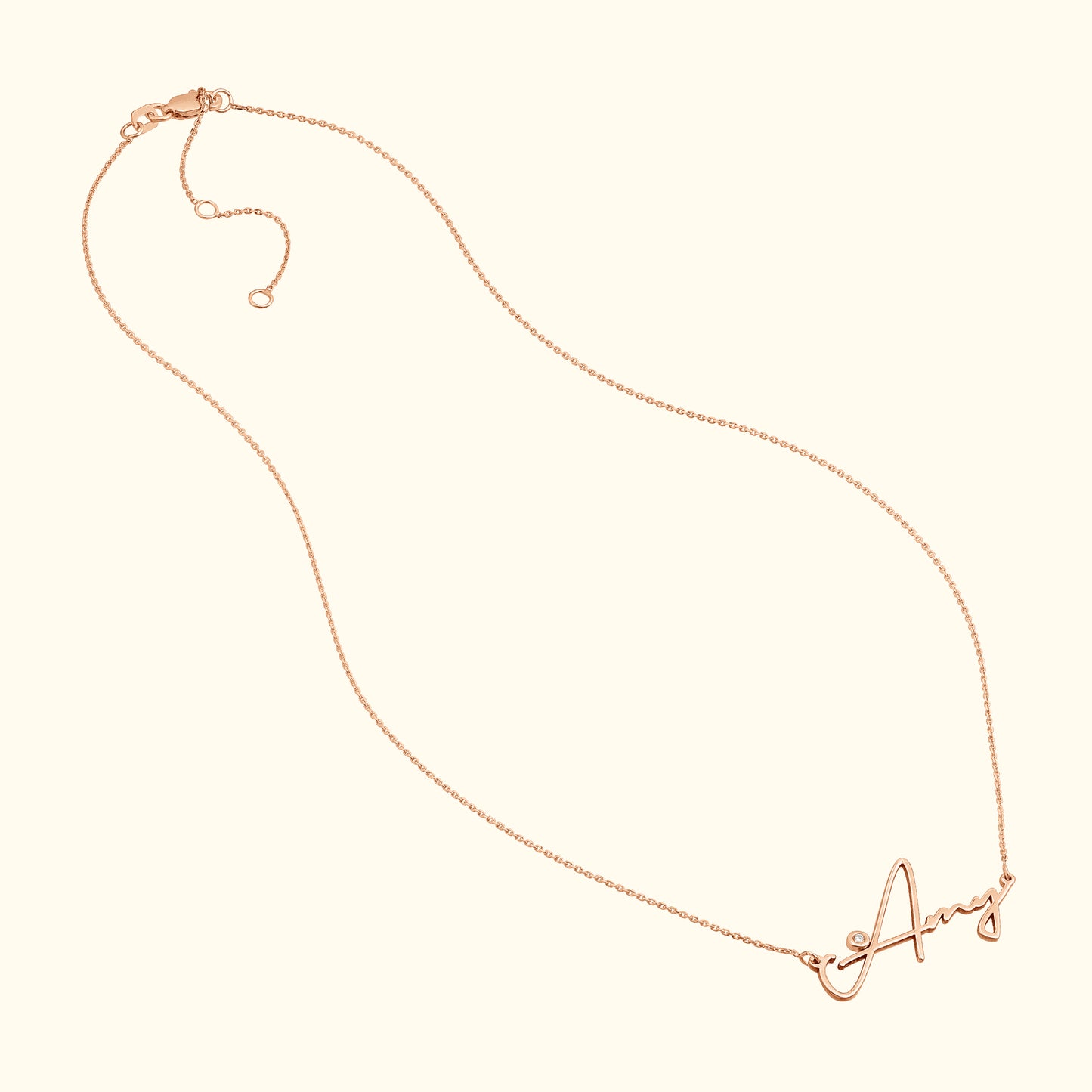 Delicate rose gold necklace featuring a cursive letter "A" pendant.