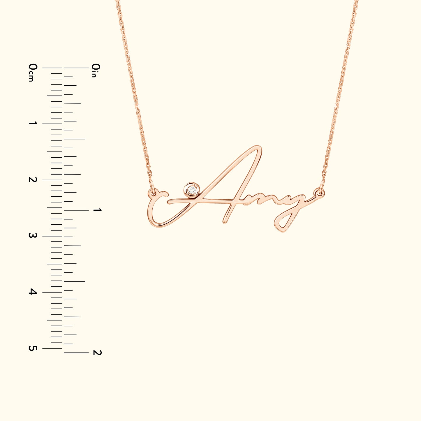 Rose gold name necklace featuring the name "Amy" with a small diamond accent.