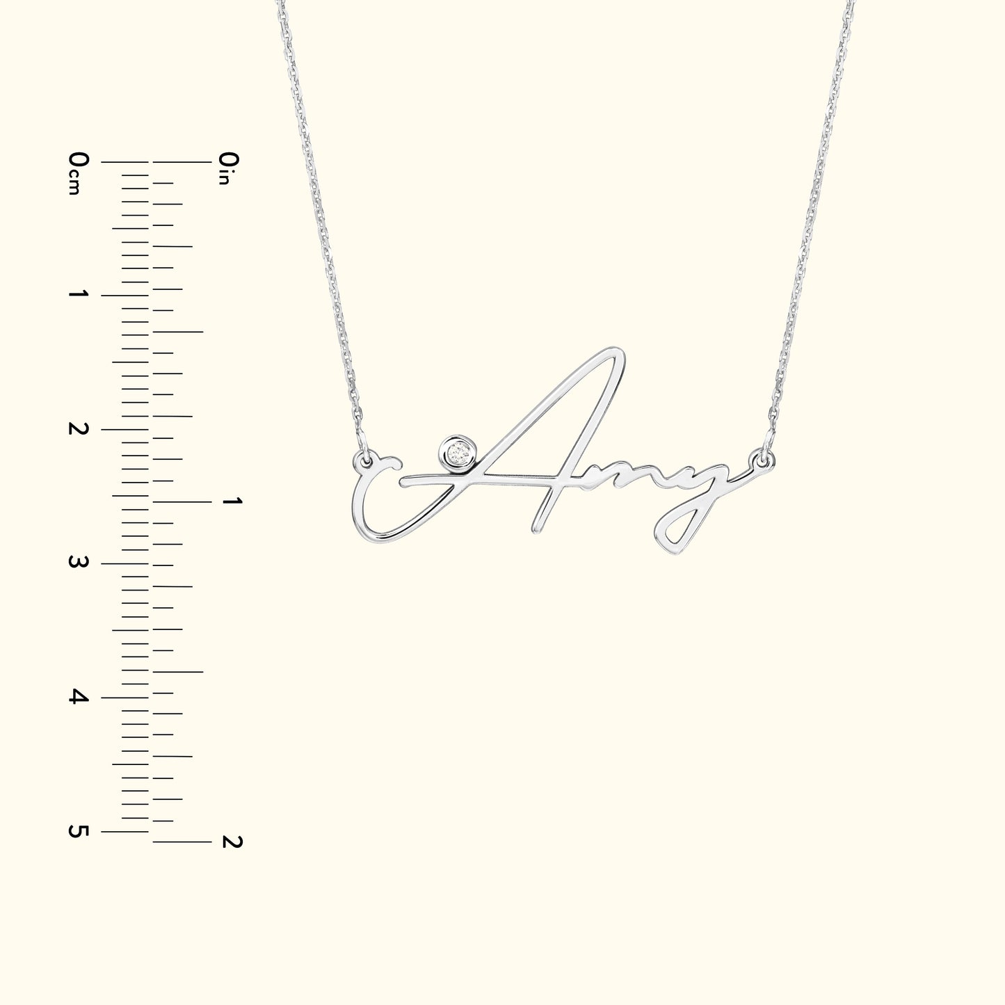 Silver name necklace with the word "Amy" and a small diamond accent.