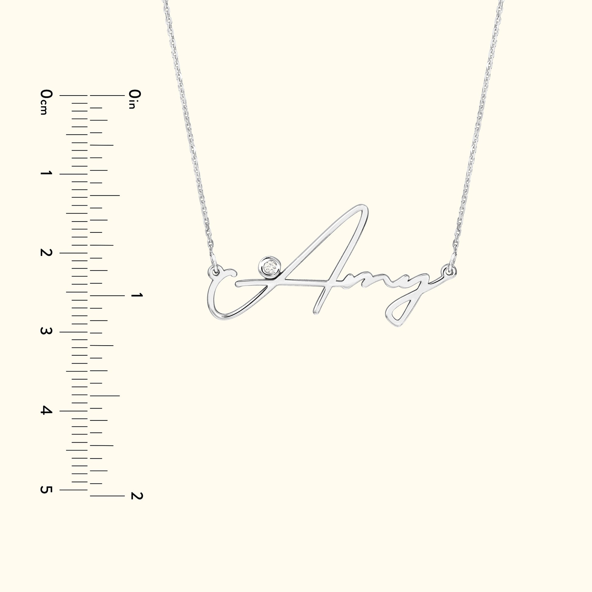 Silver name necklace with the word "Amy" and a small diamond accent.