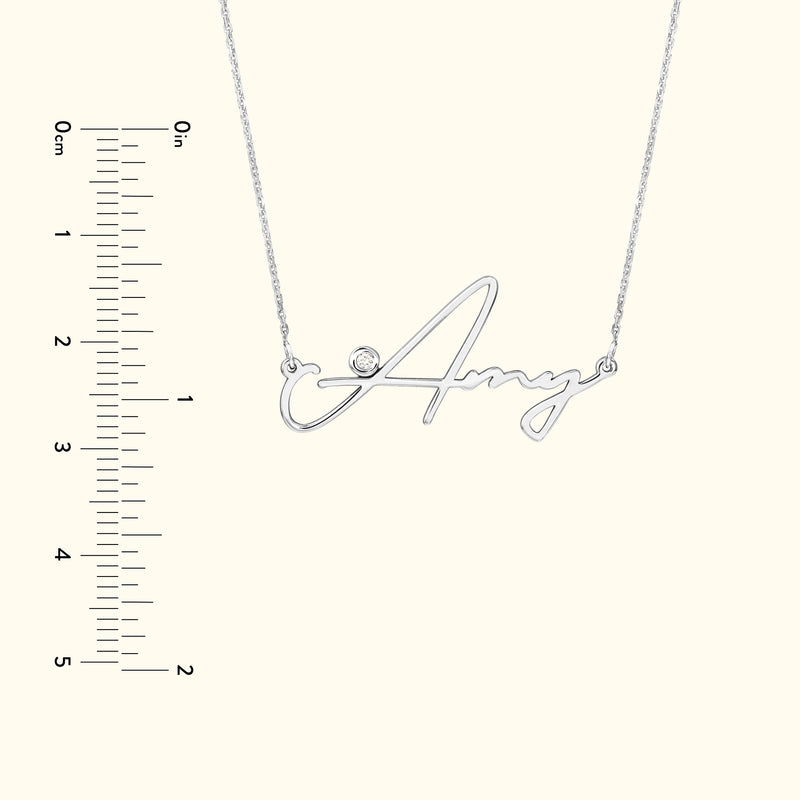 Silver name necklace with the word "Amy" and a small diamond accent.