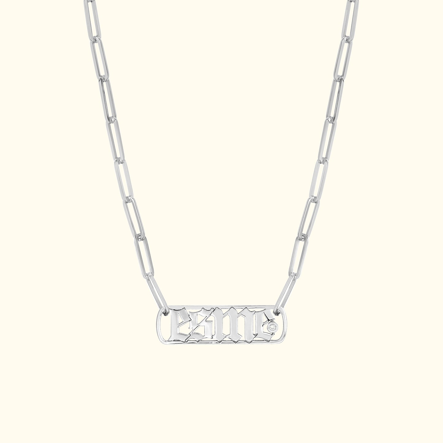 Silver chain necklace featuring an intricately designed pendant.