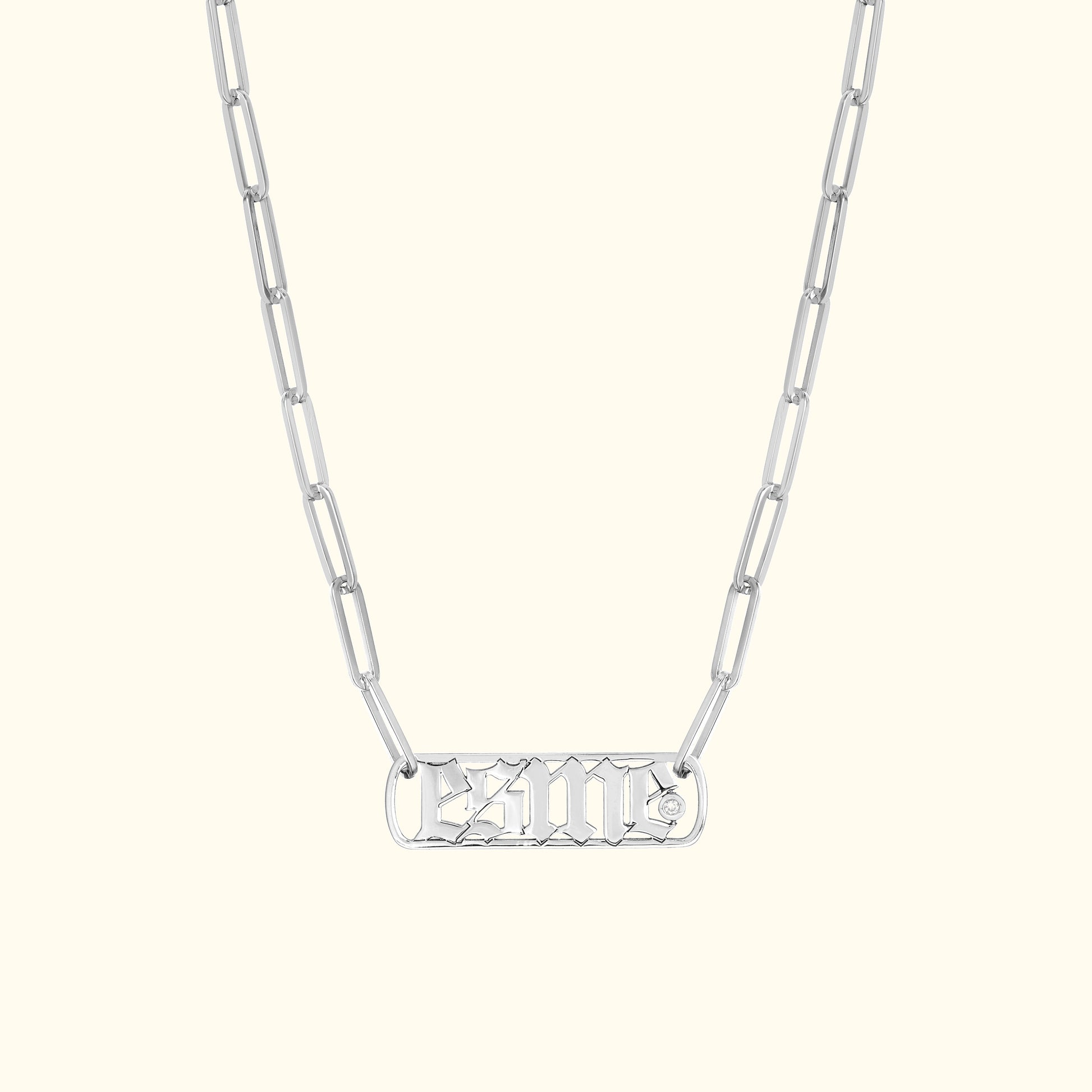 Silver chain necklace featuring an intricately designed pendant.