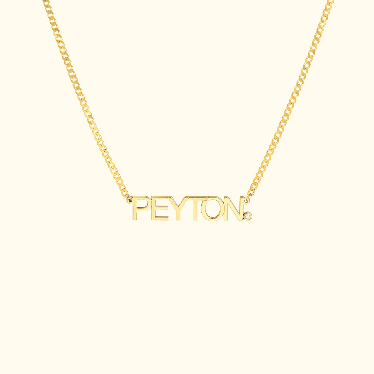 Gold necklace featuring the name "PEYTON" in bold letters.