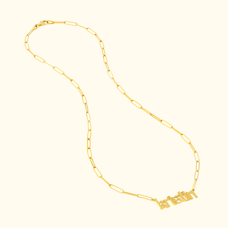 Gold chain necklace featuring a nameplate with the word "bratin."