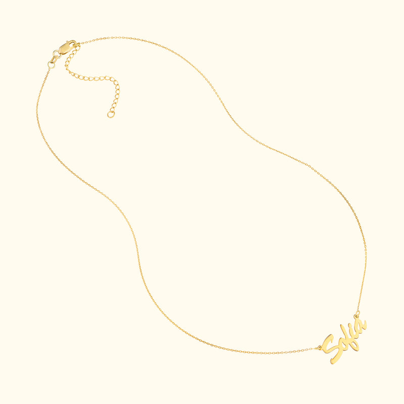Gold necklace featuring a cursive name pendant that reads "Sofia."