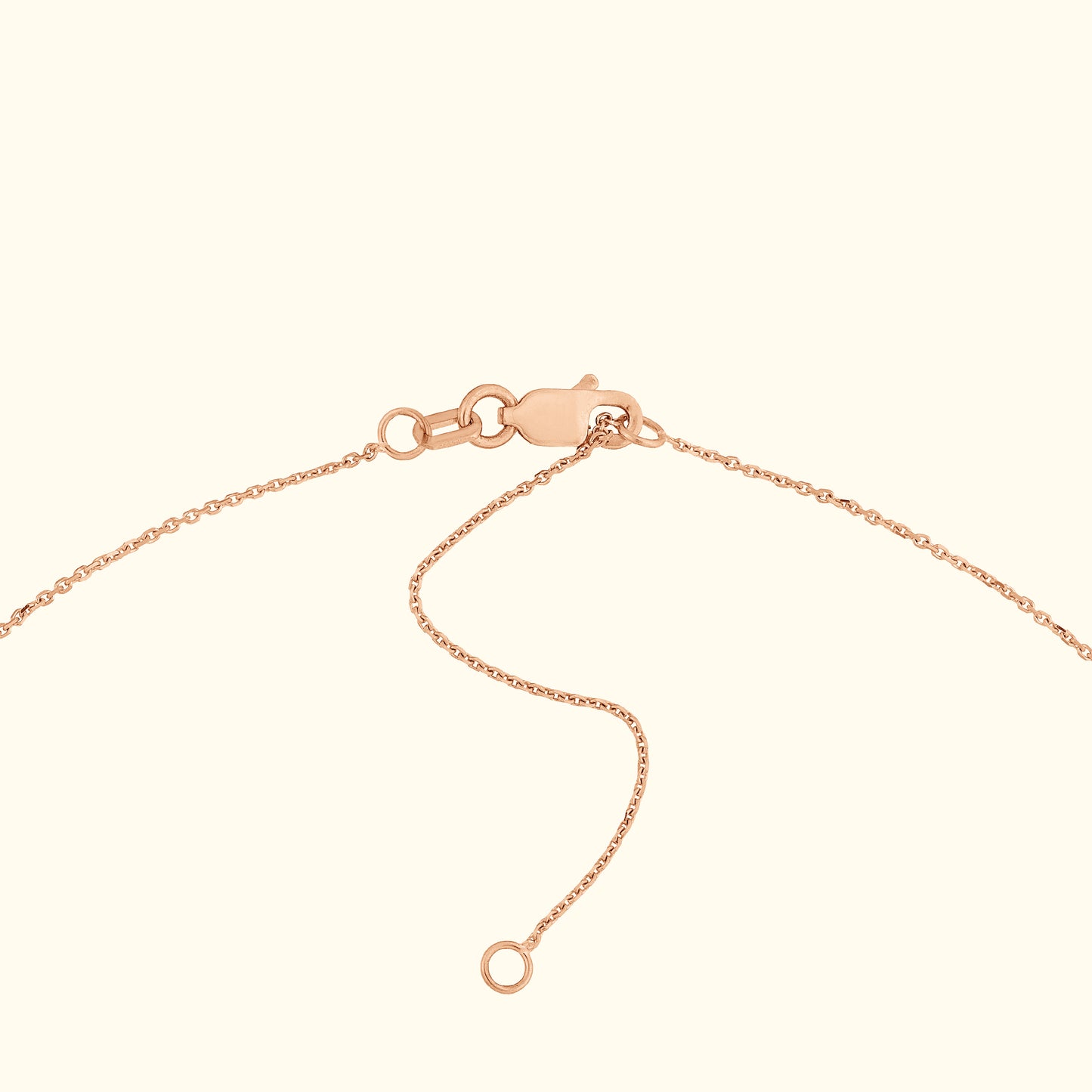 Rose gold bracelet with a lobster clasp and adjustable chain.