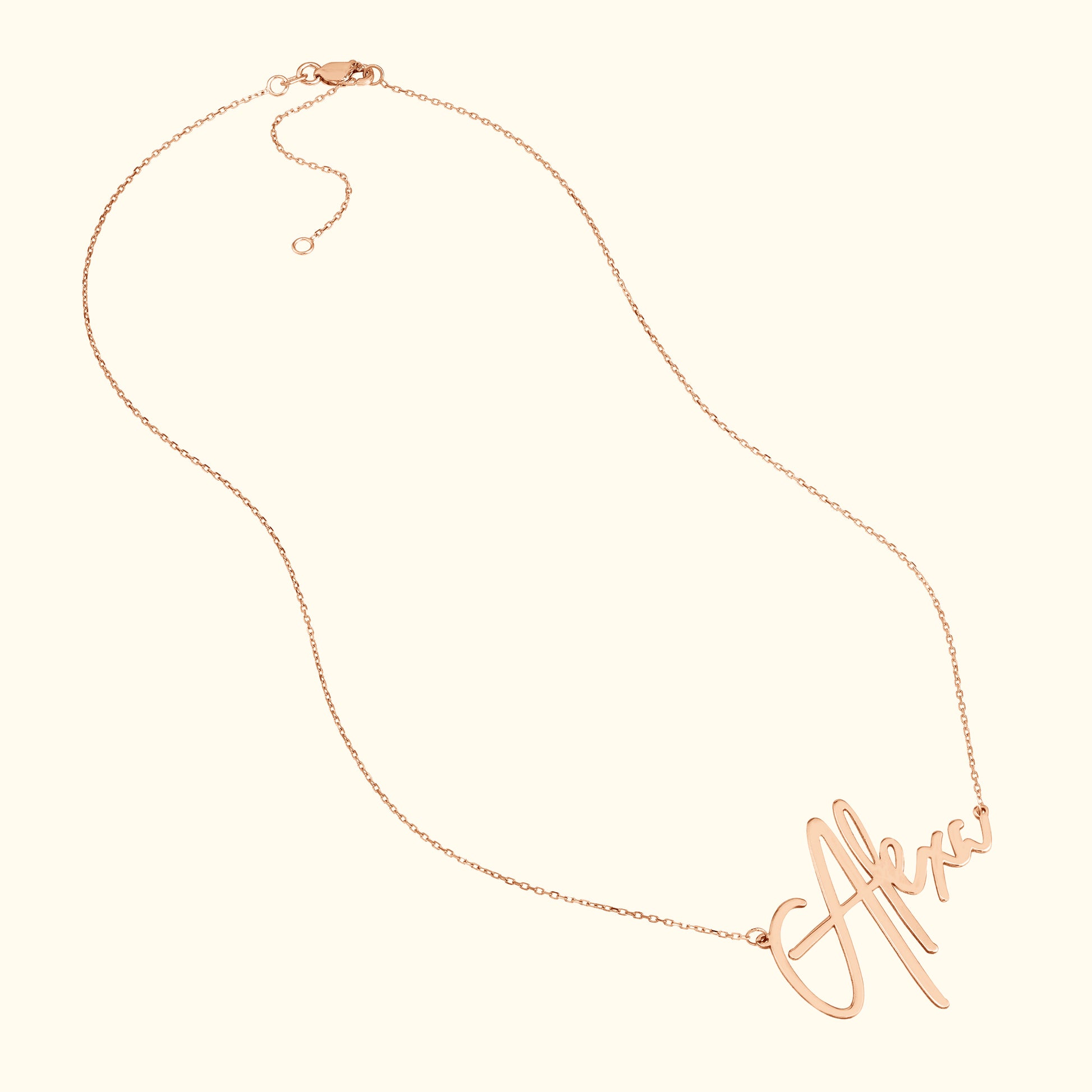 Rose gold necklace featuring a cursive name pendant.