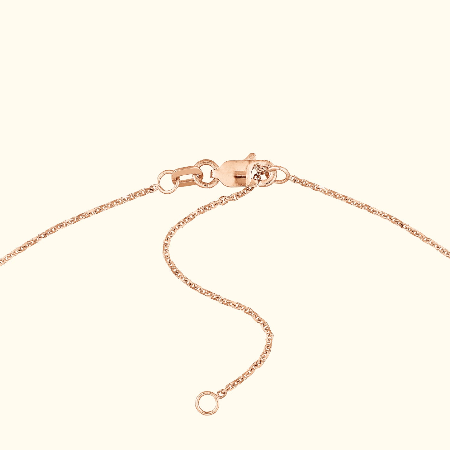 Close-up of a rose gold necklace clasp and chain.