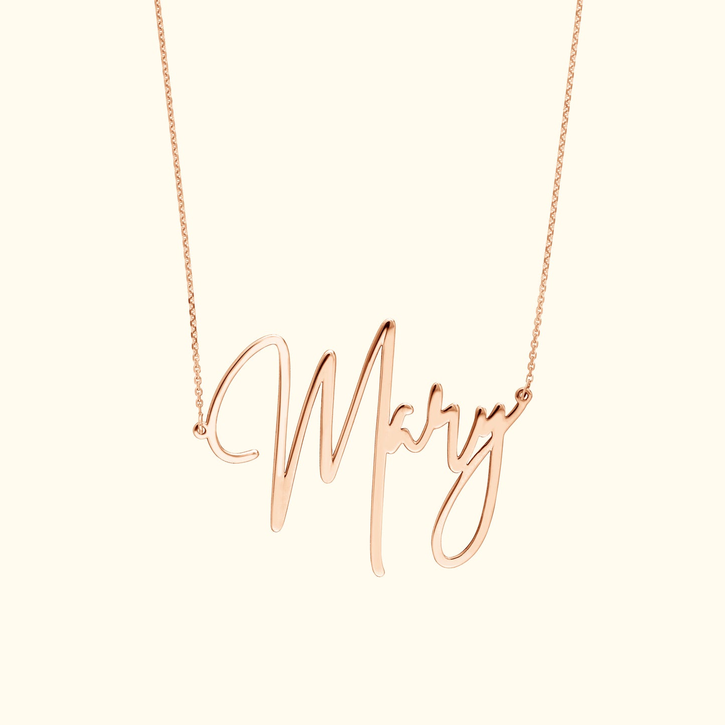 Rose gold necklace featuring a cursive name pendant "Mary".
