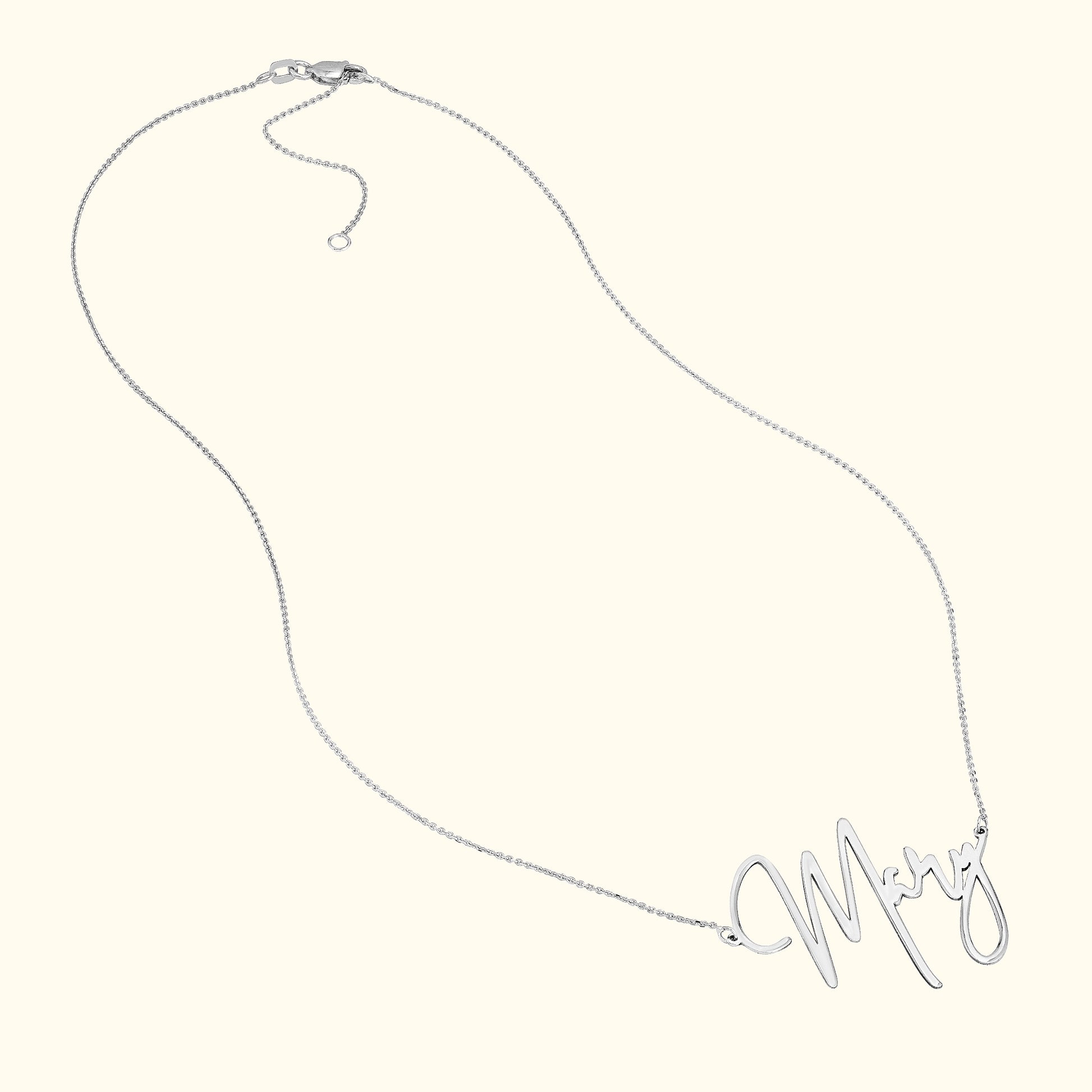 Silver necklace with the name "Mary" delicately scripted as the centerpiece.