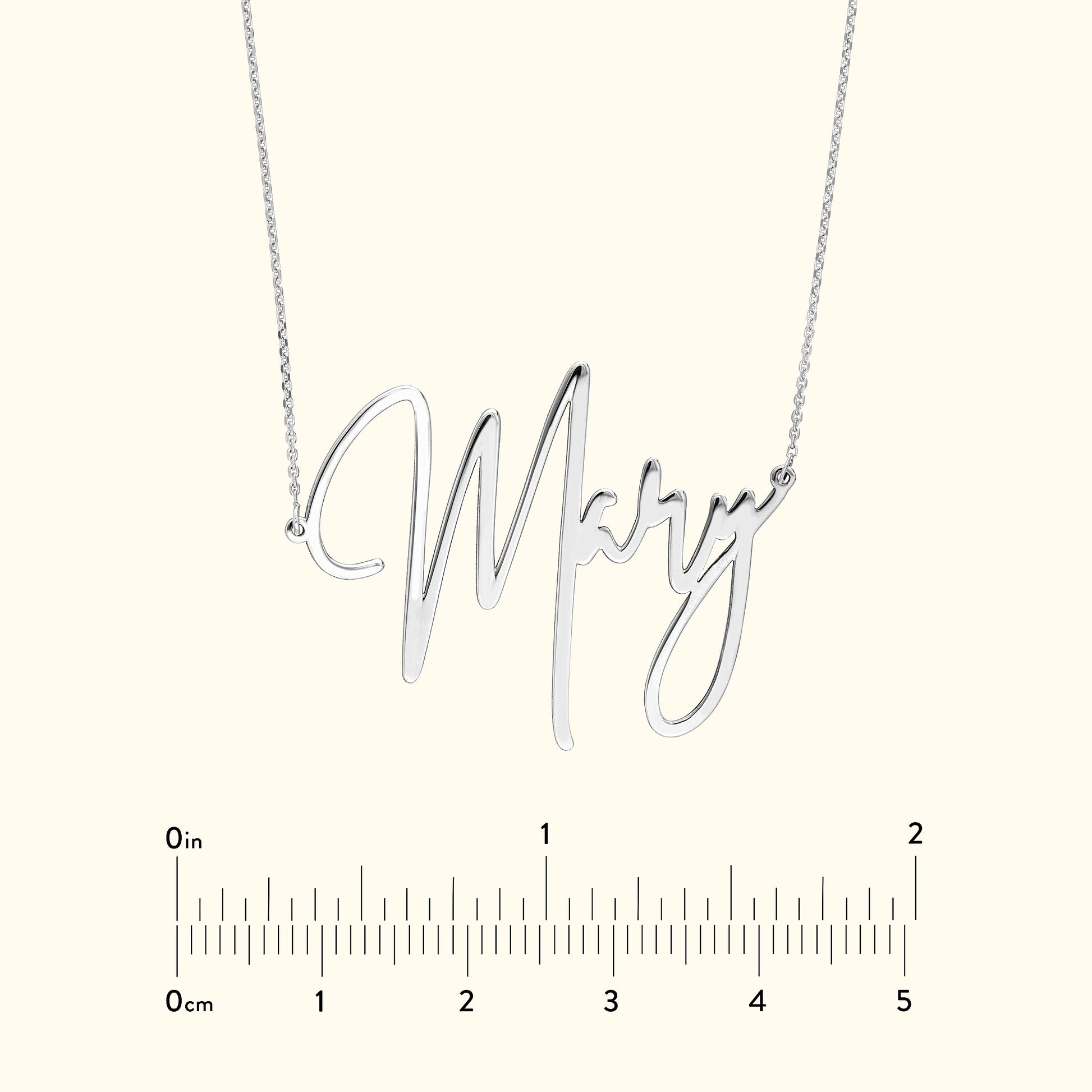 Silver necklace featuring the name "Mary" in cursive lettering.