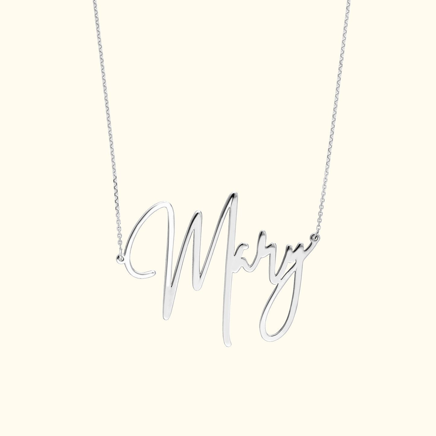 Silver necklace featuring a cursive 'Mary' pendant.