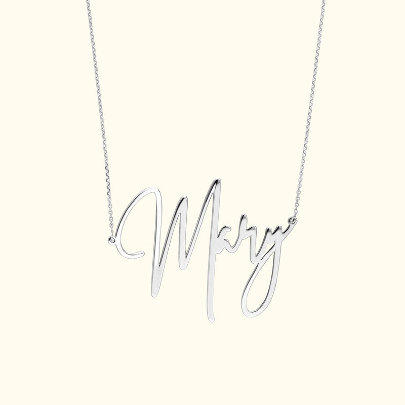 Silver necklace featuring a cursive 'Mary' pendant.