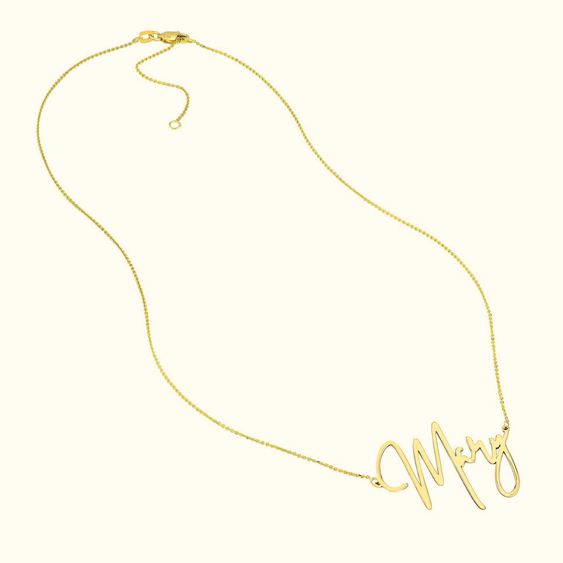 Gold necklace with a flowing script spelling "Mary."
