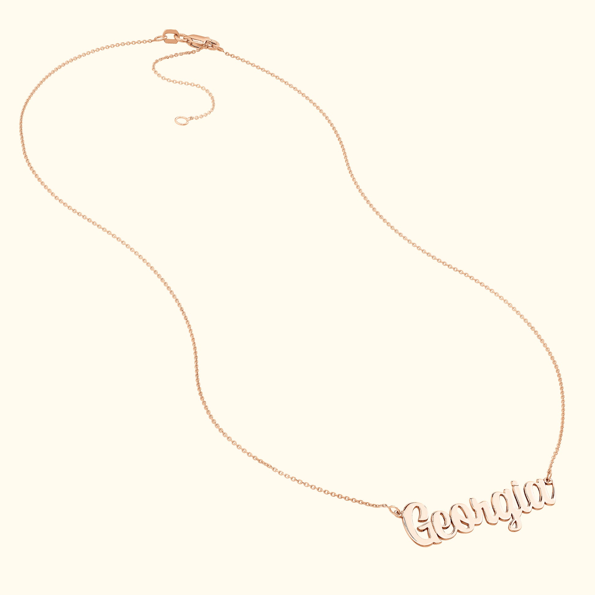Rose gold name necklace with the word "Georgia" in an elegant script font.