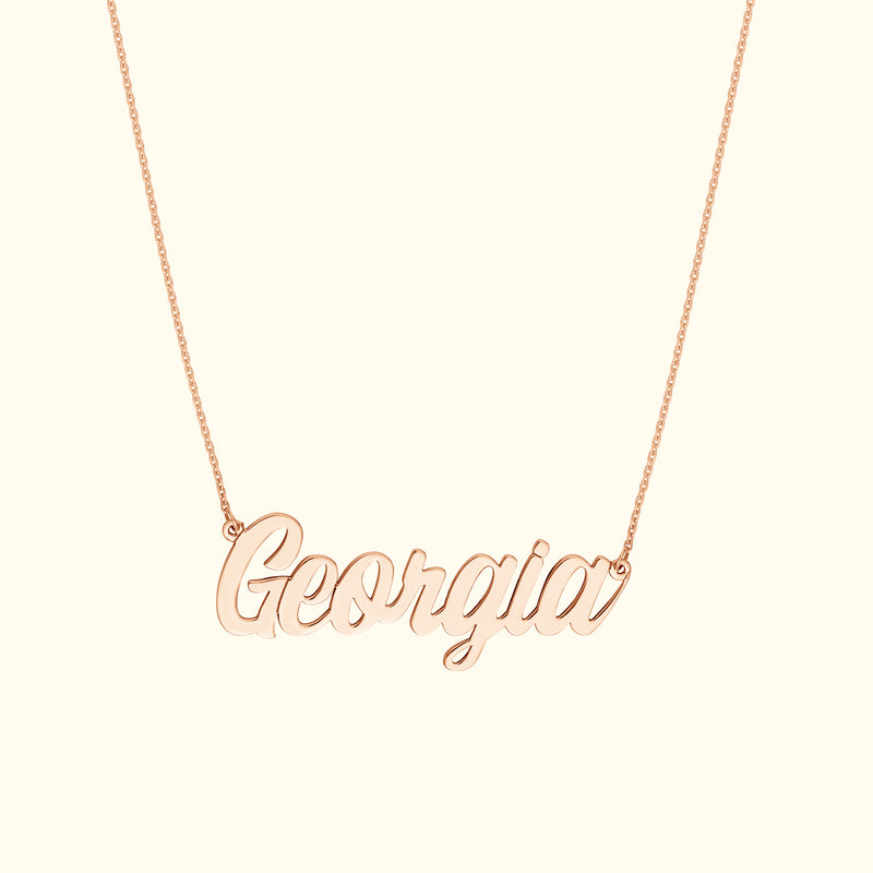 Rose gold necklace featuring the name "Georgia" in cursive lettering.