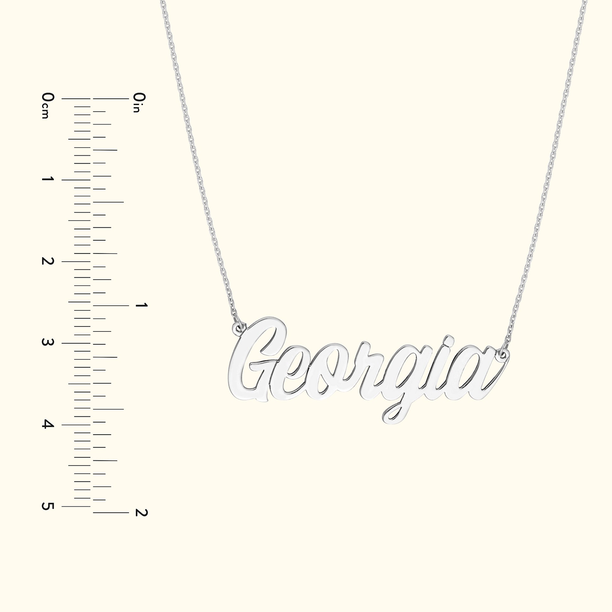 Silver necklace featuring the name "Georgia" in a cursive font.