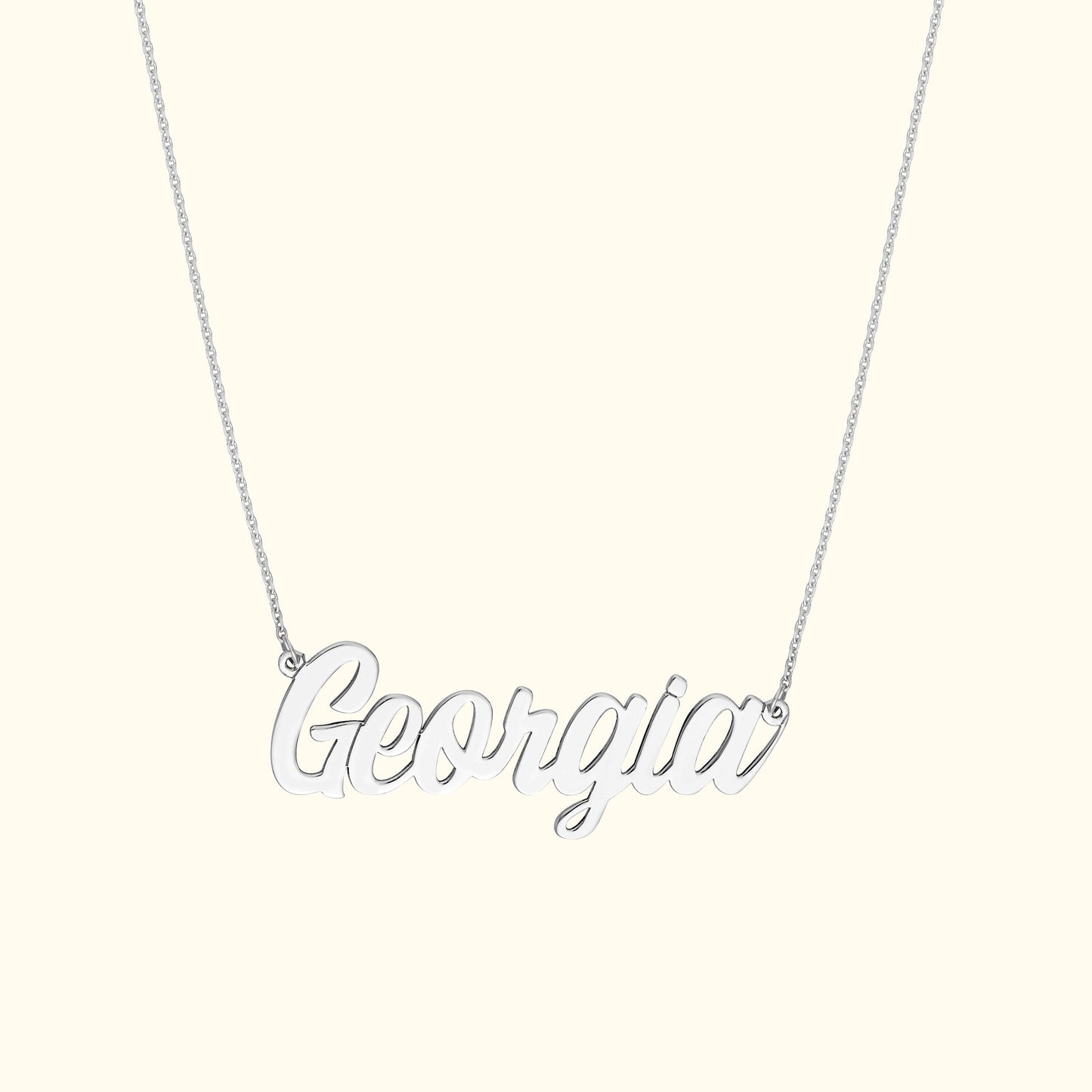 Silver necklace with the name "Georgia" elegantly scripted.