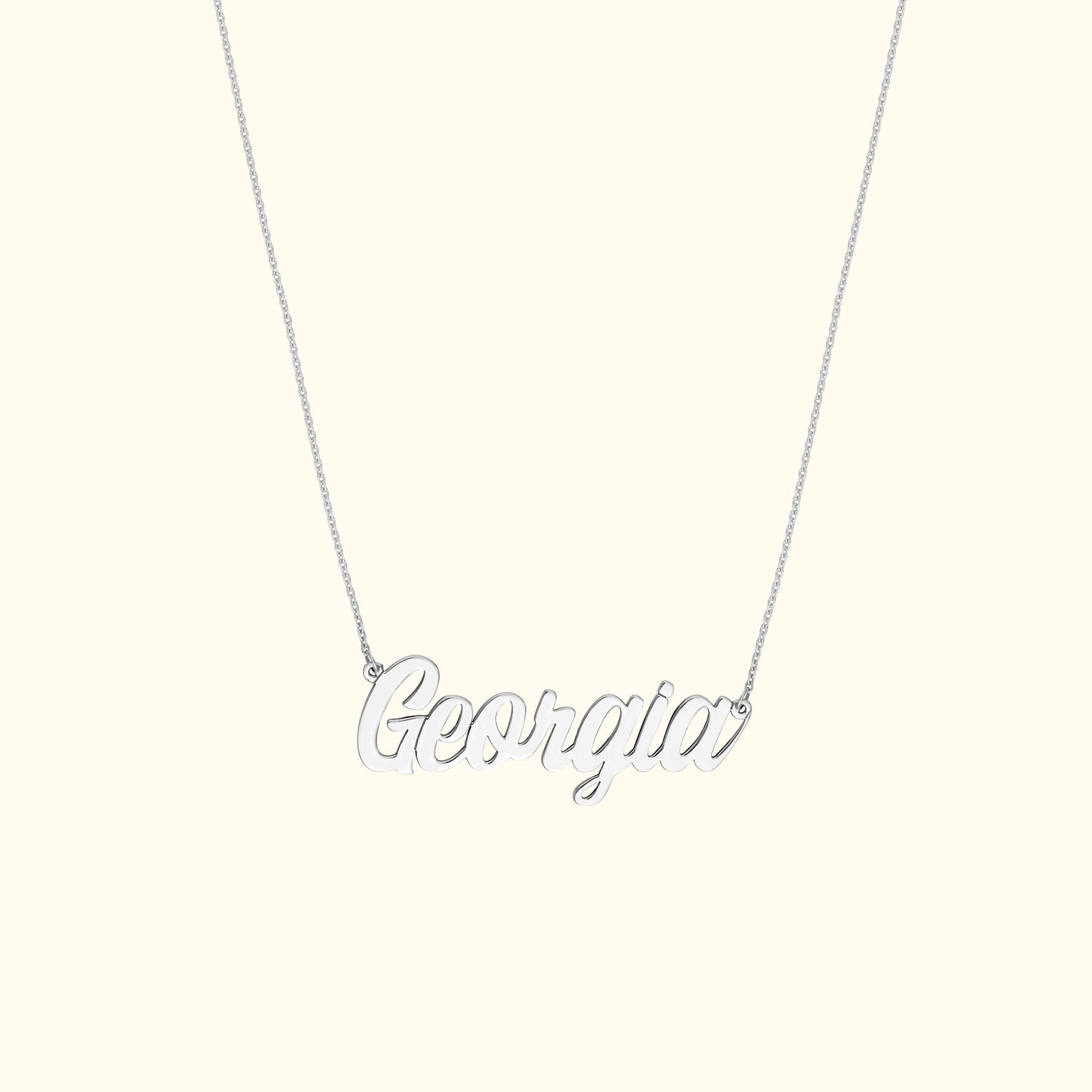 Silver necklace featuring the name "Georgia" in cursive lettering.