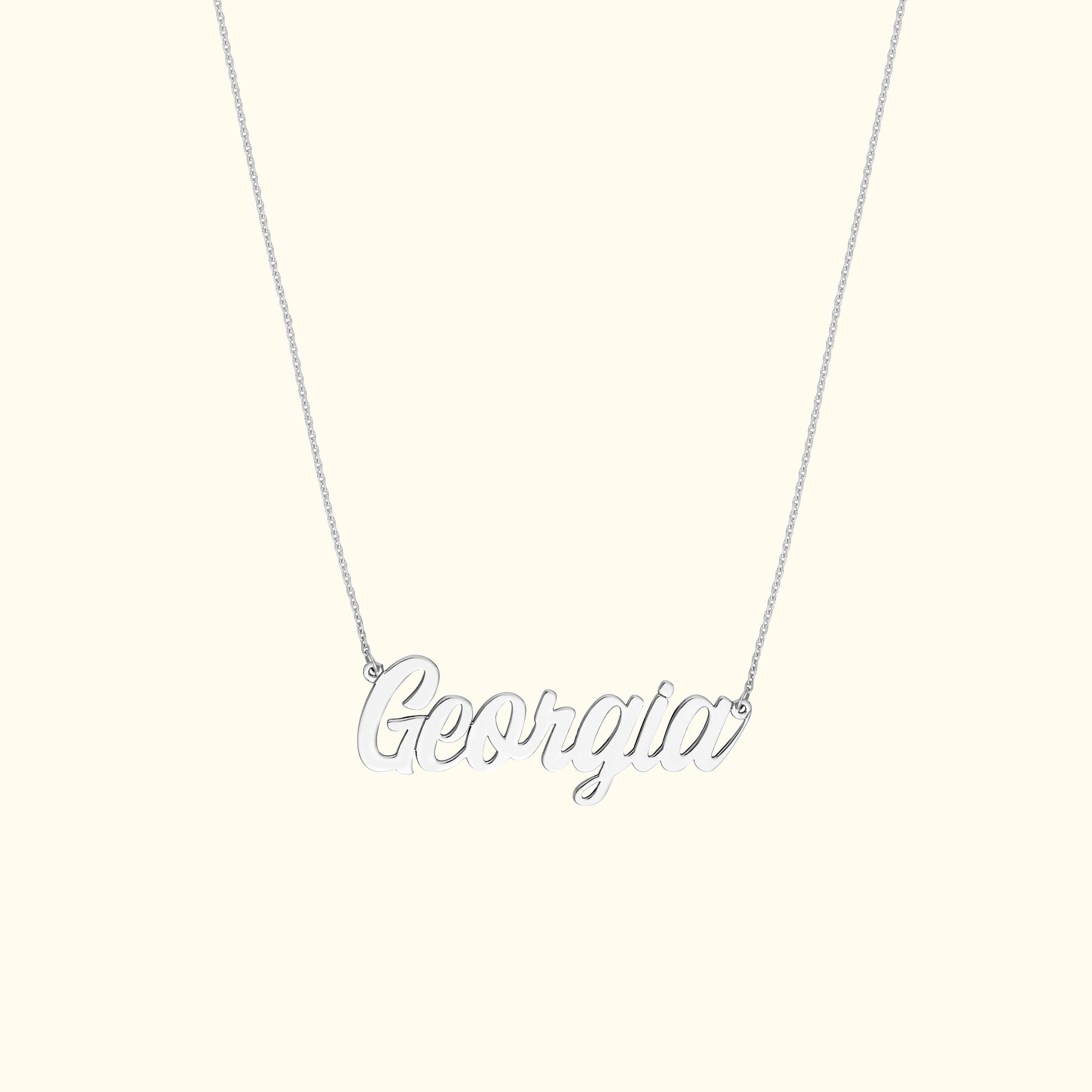 Silver necklace featuring the name "Georgia" in cursive lettering.