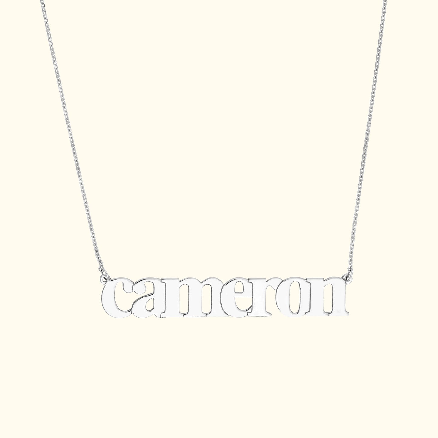 Silver name necklace featuring the word "cameron" in lowercase letters.