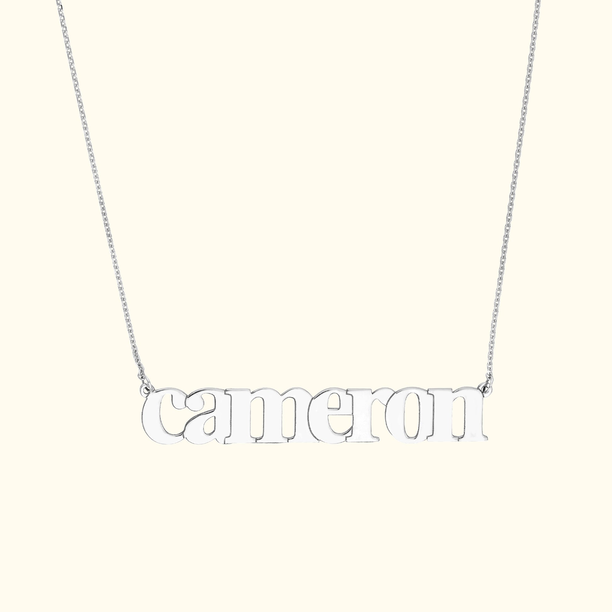 Silver name necklace featuring the word "cameron" in lowercase letters.
