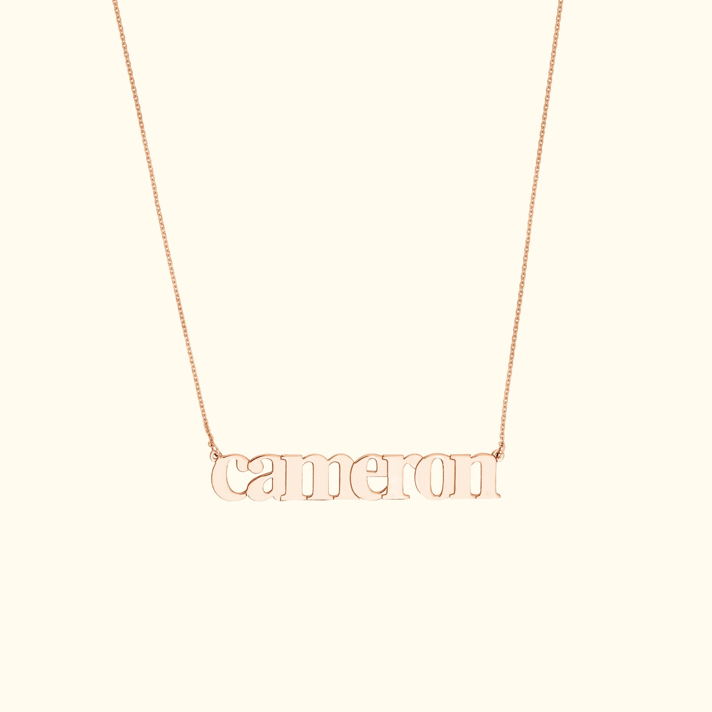 Rose gold necklace featuring the name "Cameron" in a stylish font.