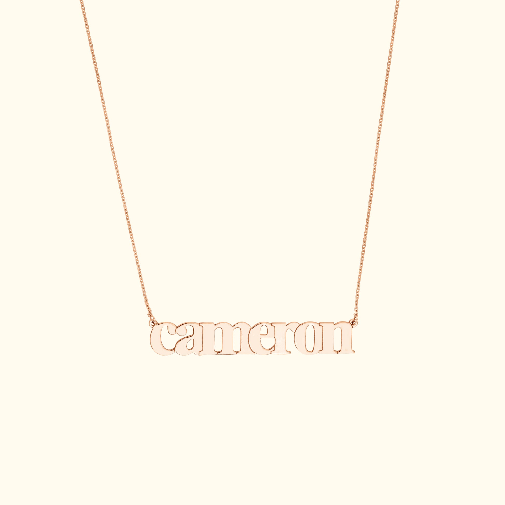 Rose gold necklace featuring the name "Cameron" in a stylish font.