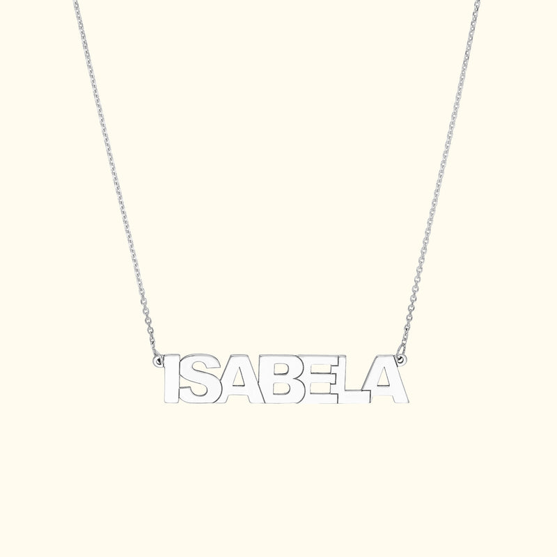 Silver necklace featuring the name "ISABELA" in bold capital letters.