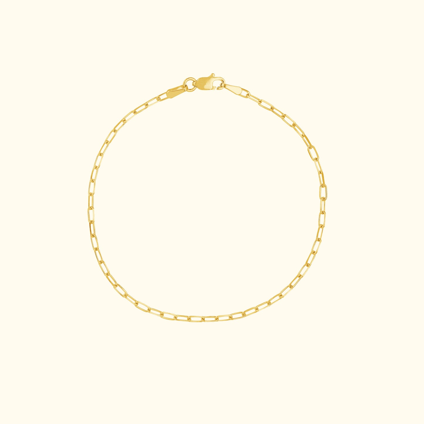 Delicate gold chain bracelet with interlocking links and a lobster clasp.