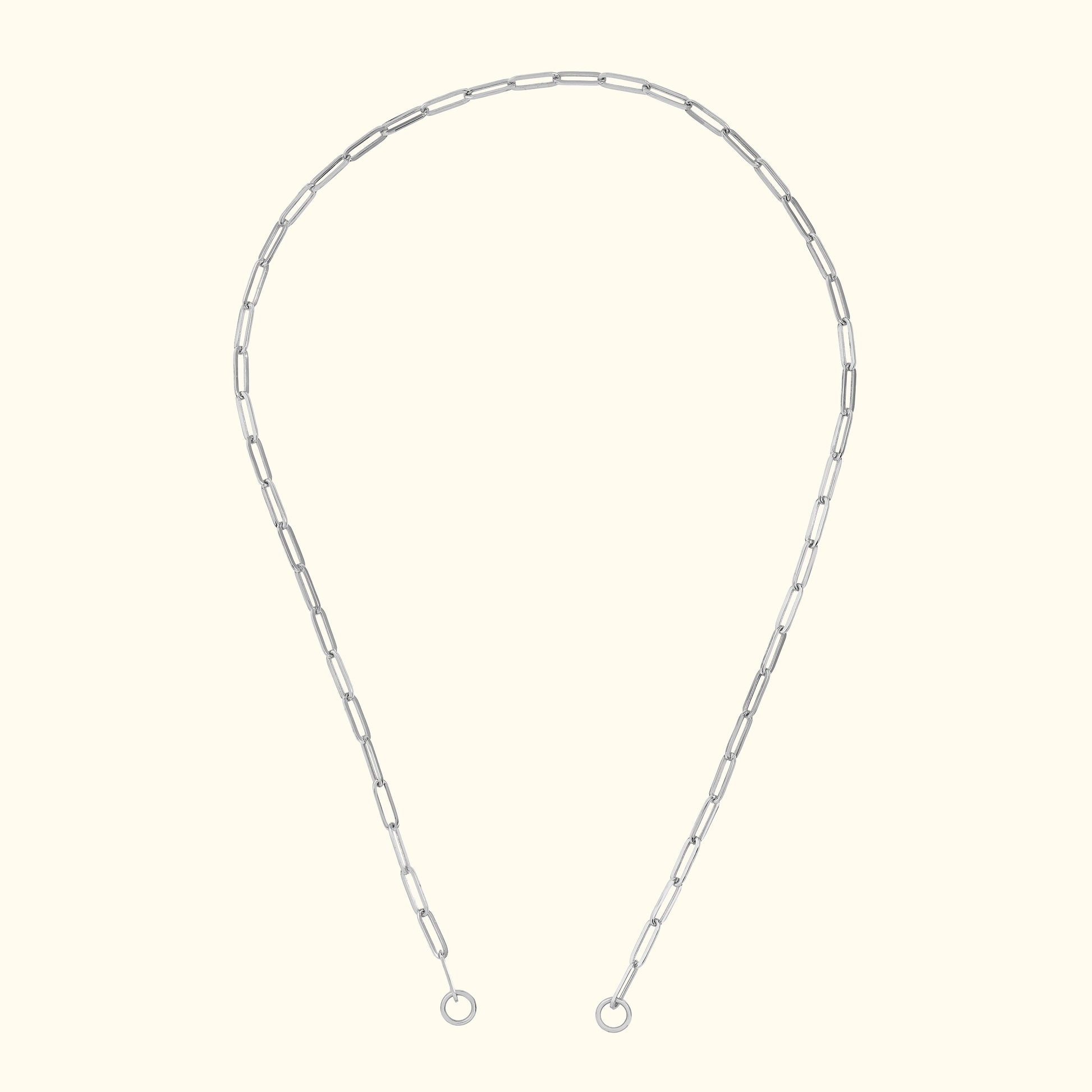 Silver chain necklace with elongated links, displayed against a light background.
