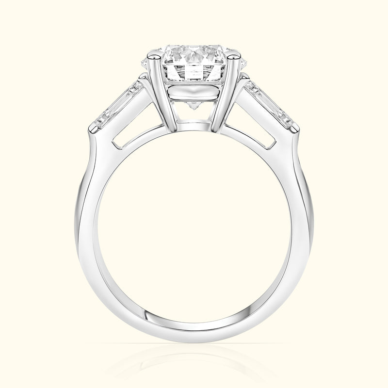 Elegant silver engagement ring featuring a central diamond and two side stones.