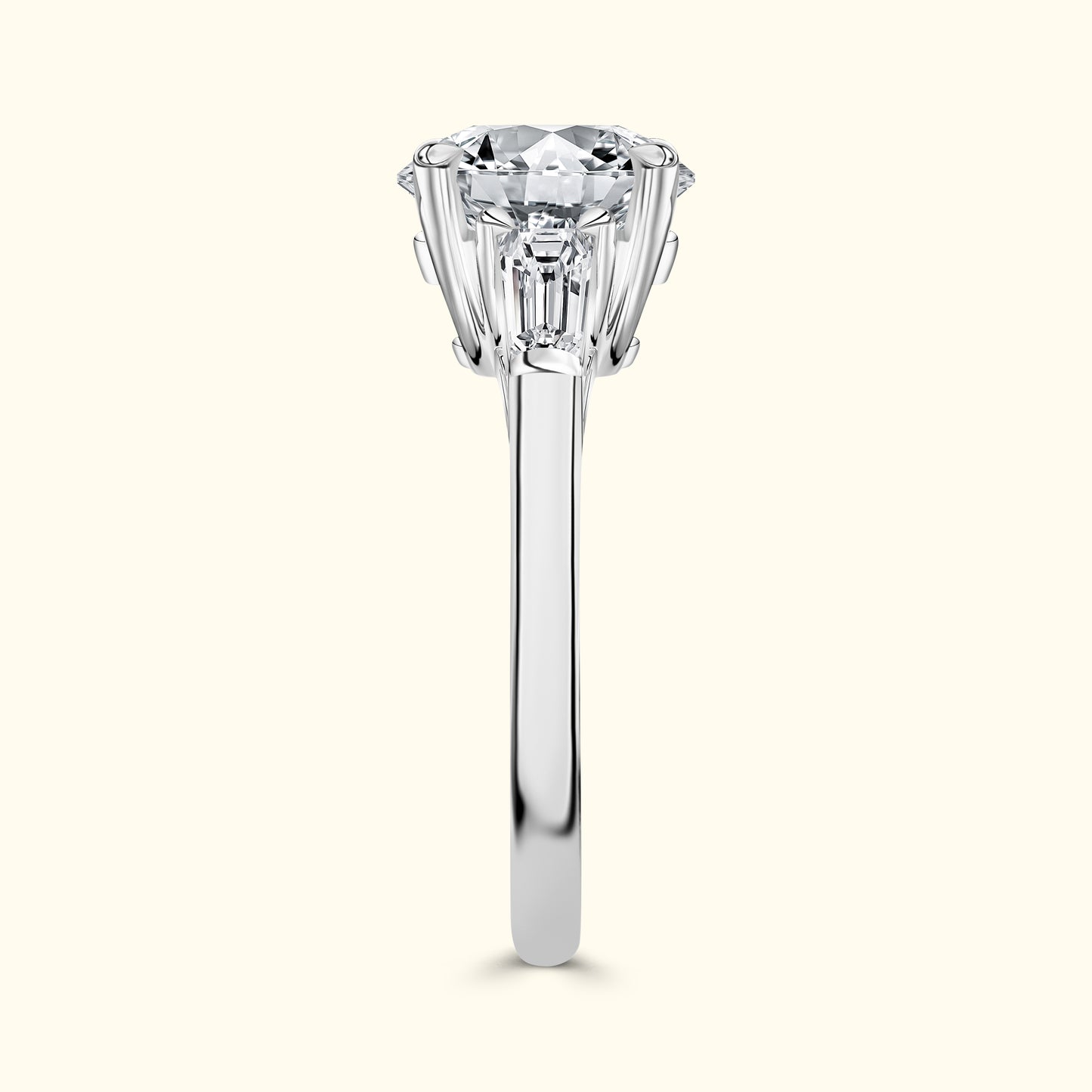 Solitaire engagement ring with a round diamond, set in a sleek white metal band.