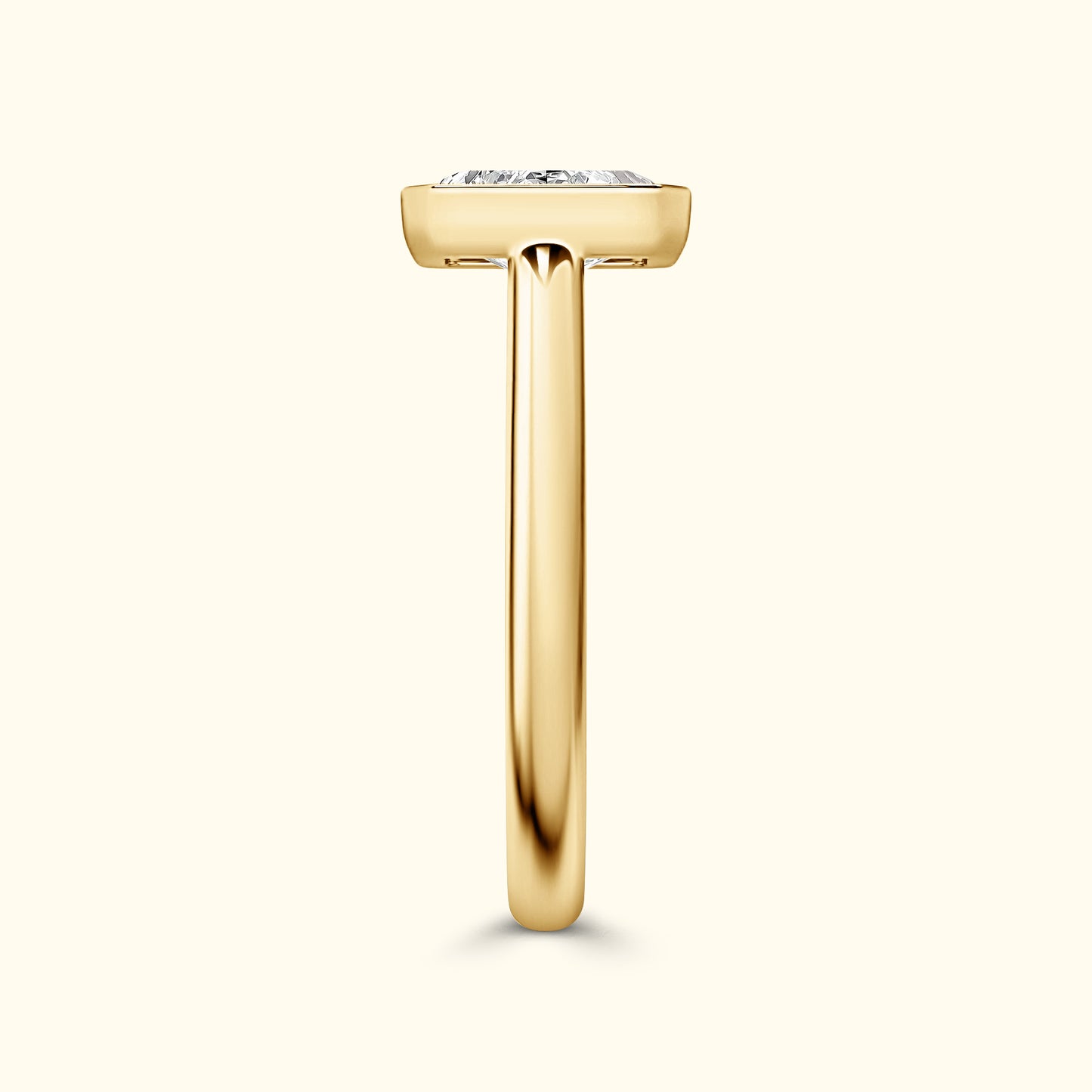 Elegant gold ring showcasing a large diamond on a slender band.