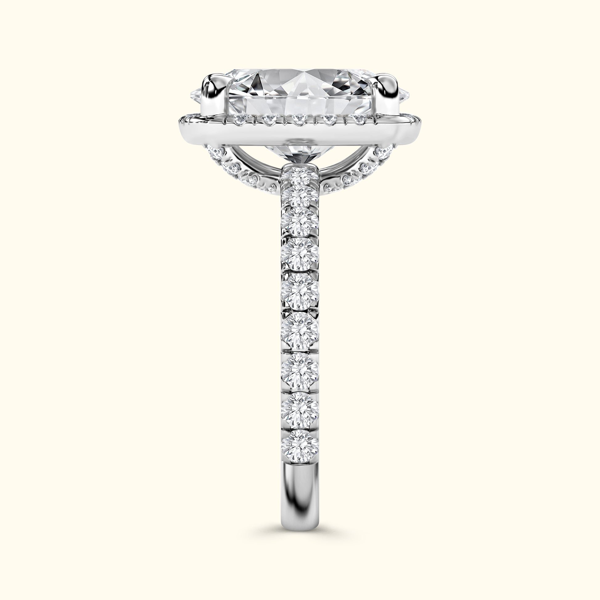 Diamond engagement ring with a large center stone and a pave band.