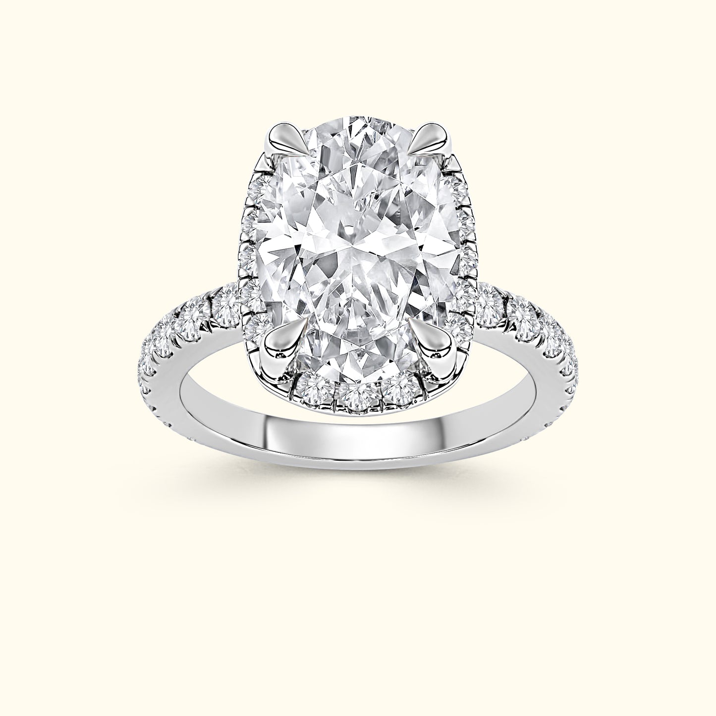Cushion-cut diamond engagement ring with a halo of smaller diamonds on a polished band.