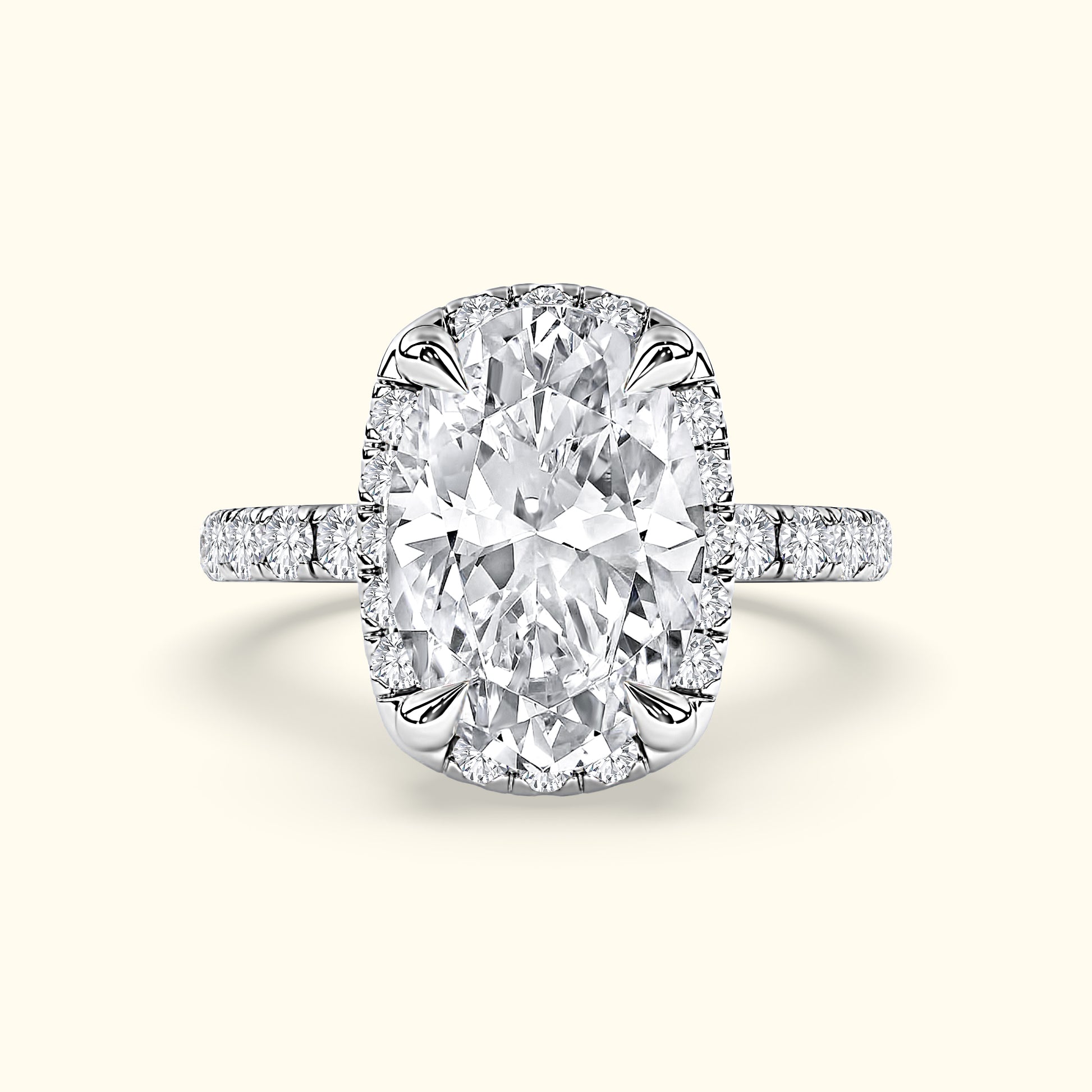 Brilliant oval diamond ring with a halo and a delicate diamond band.