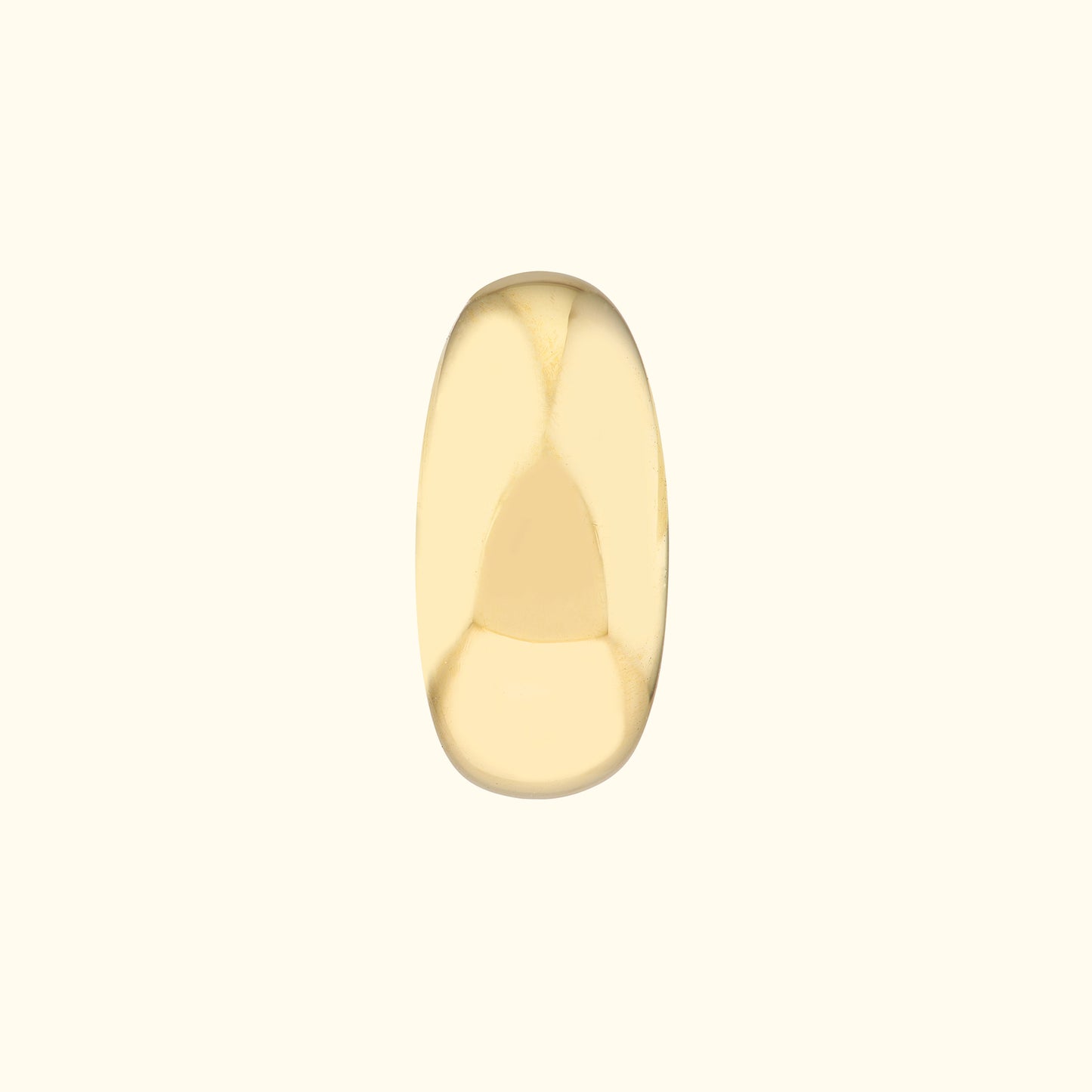 Smooth, polished gold ring with an oval shape against a light background.