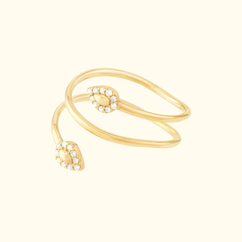 Two intertwining gold rings with teardrop-shaped ends adorned with small diamonds.