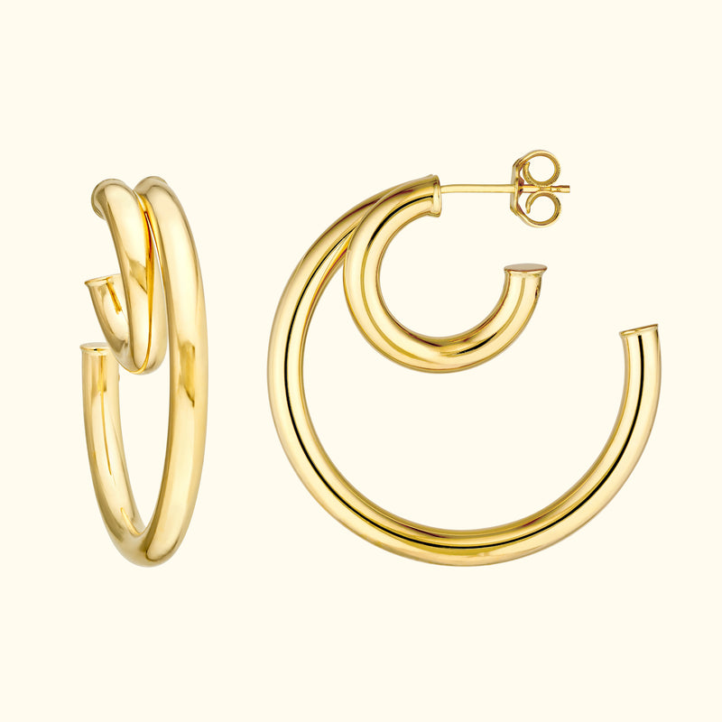 Sleek gold hoop earrings with a modern, twisted design.