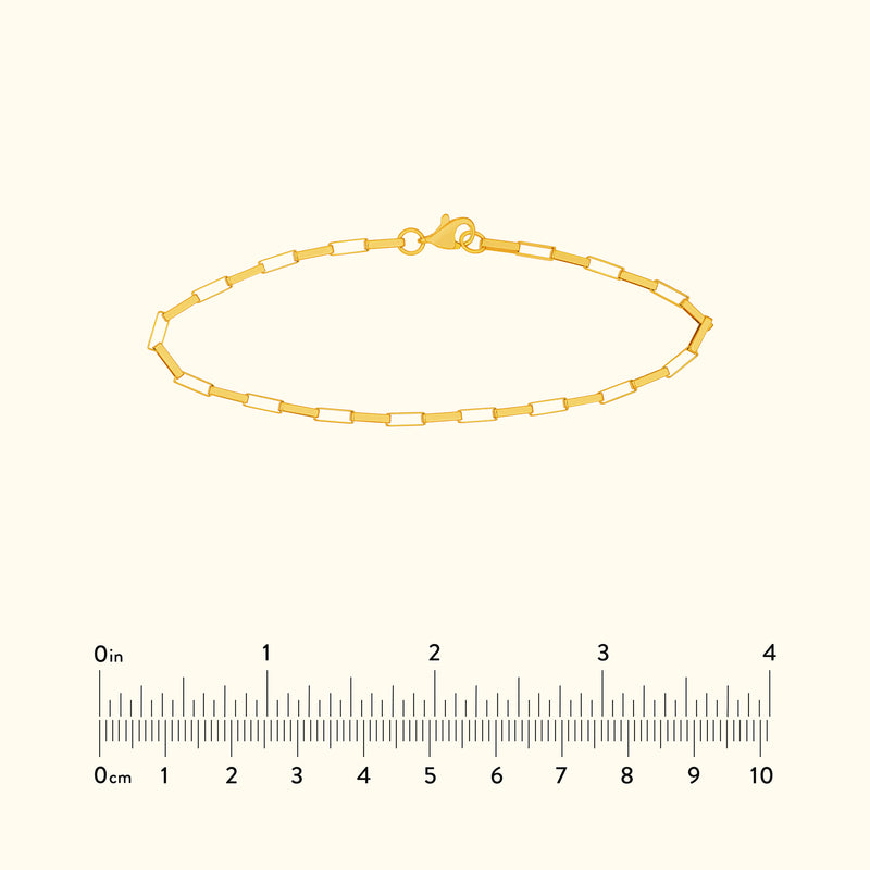 Gold chain bracelet with rectangular links and a lobster clasp.