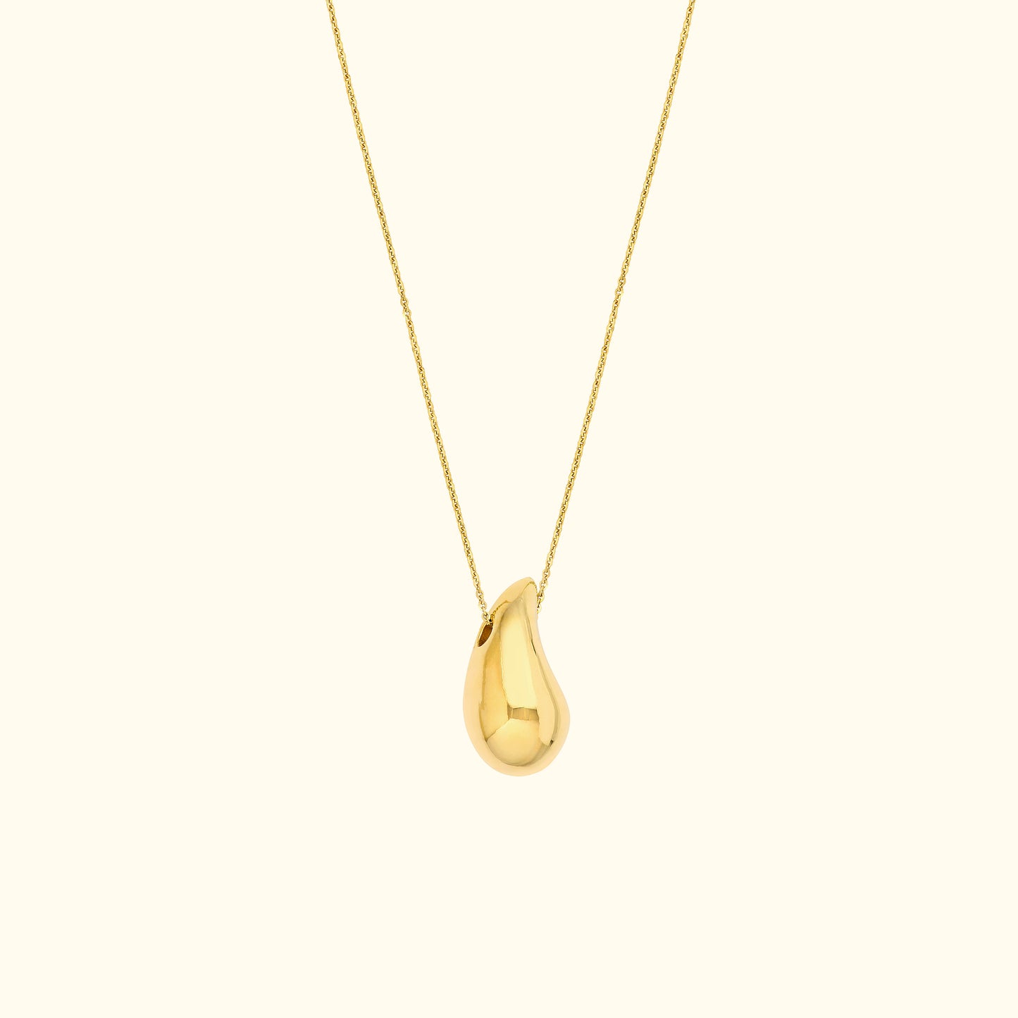 Gold pendant necklace with a teardrop-shaped charm on a delicate chain.