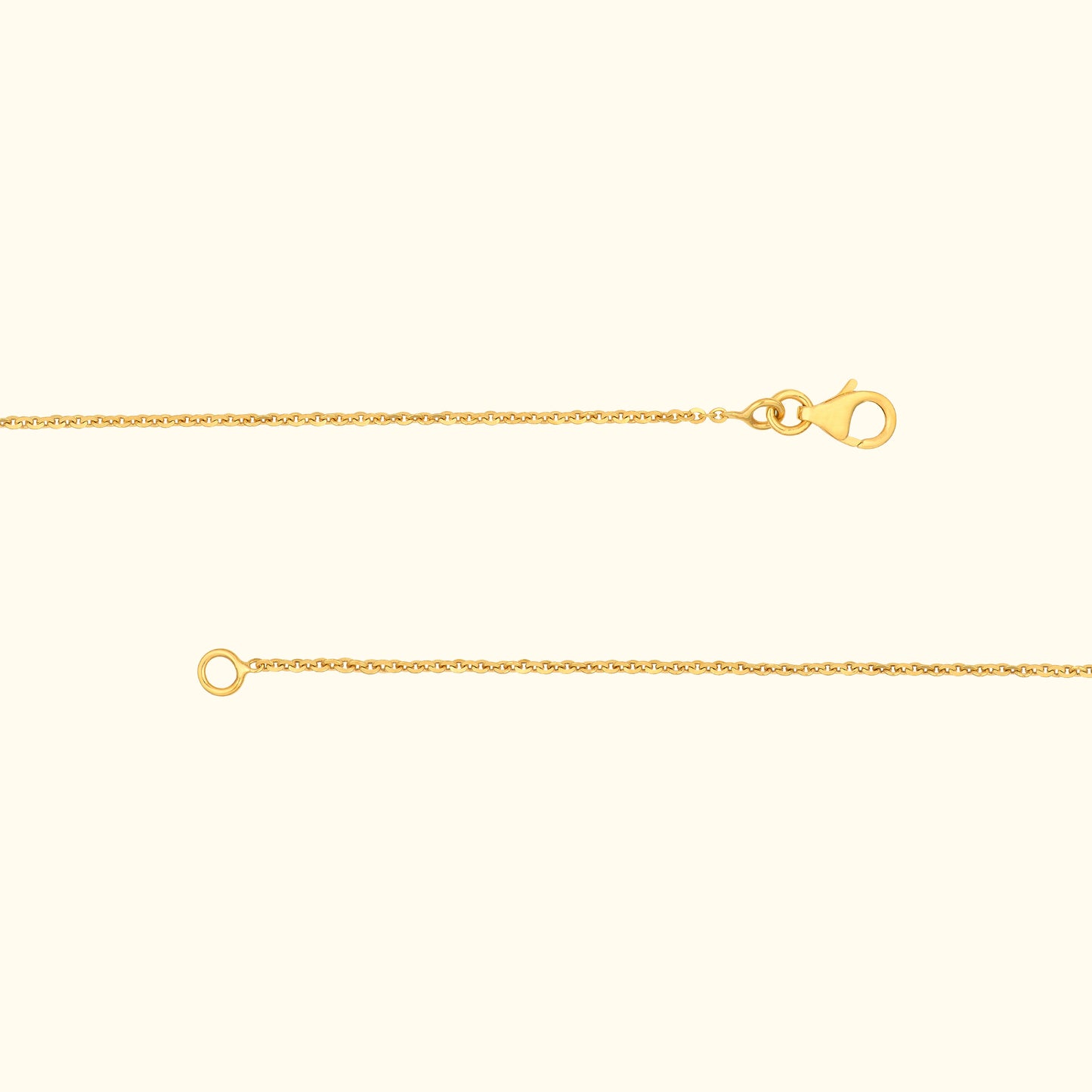 A delicate gold chain with a lobster clasp and a circular loop at the end.