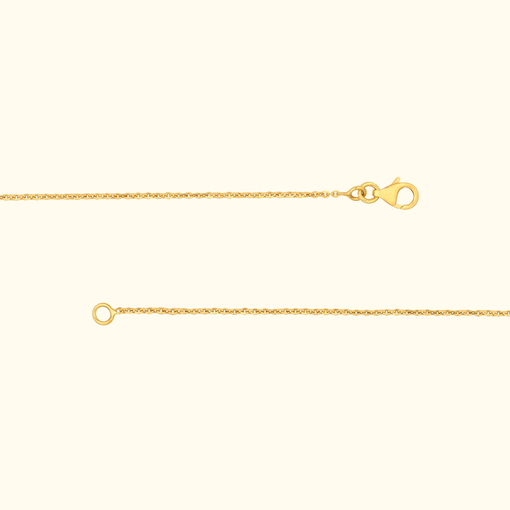 A delicate gold chain with a lobster clasp and a circular loop at the end.