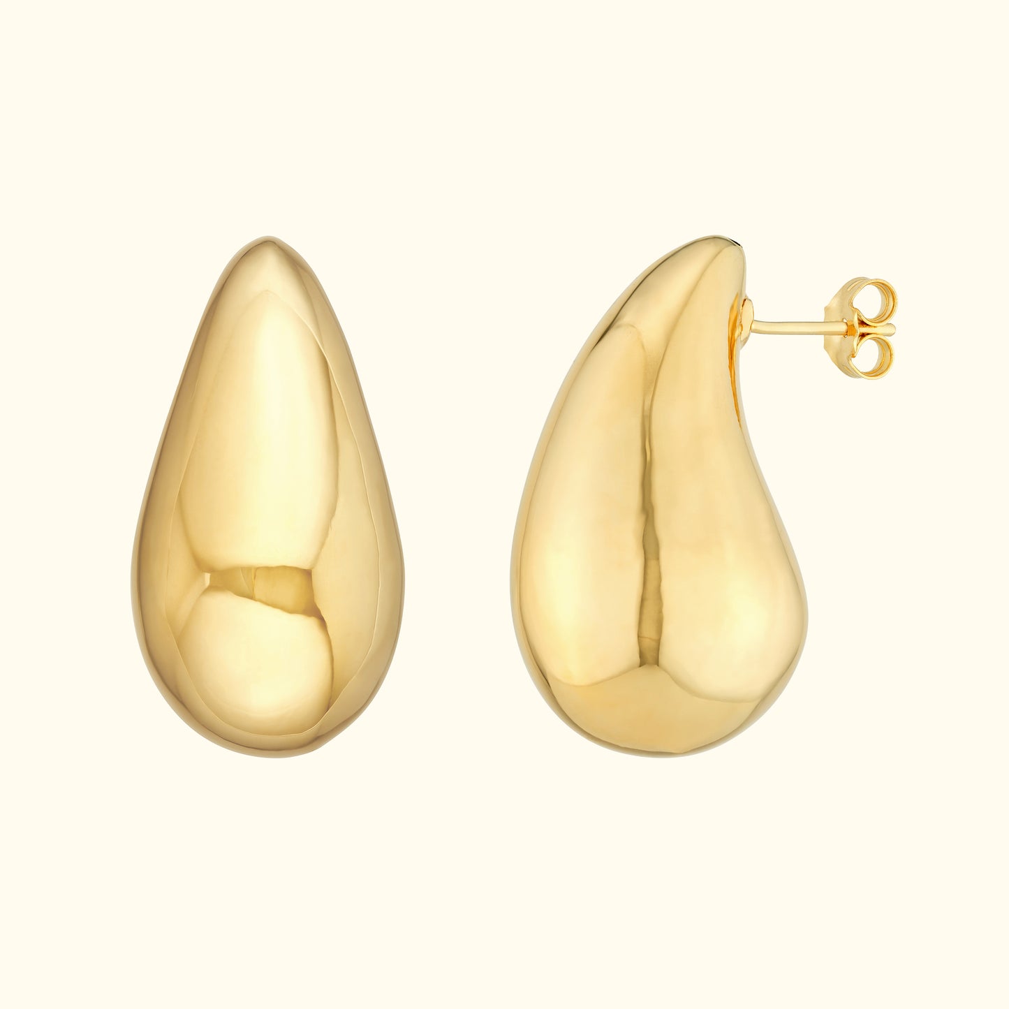 Shiny gold teardrop earrings with a smooth, reflective surface.