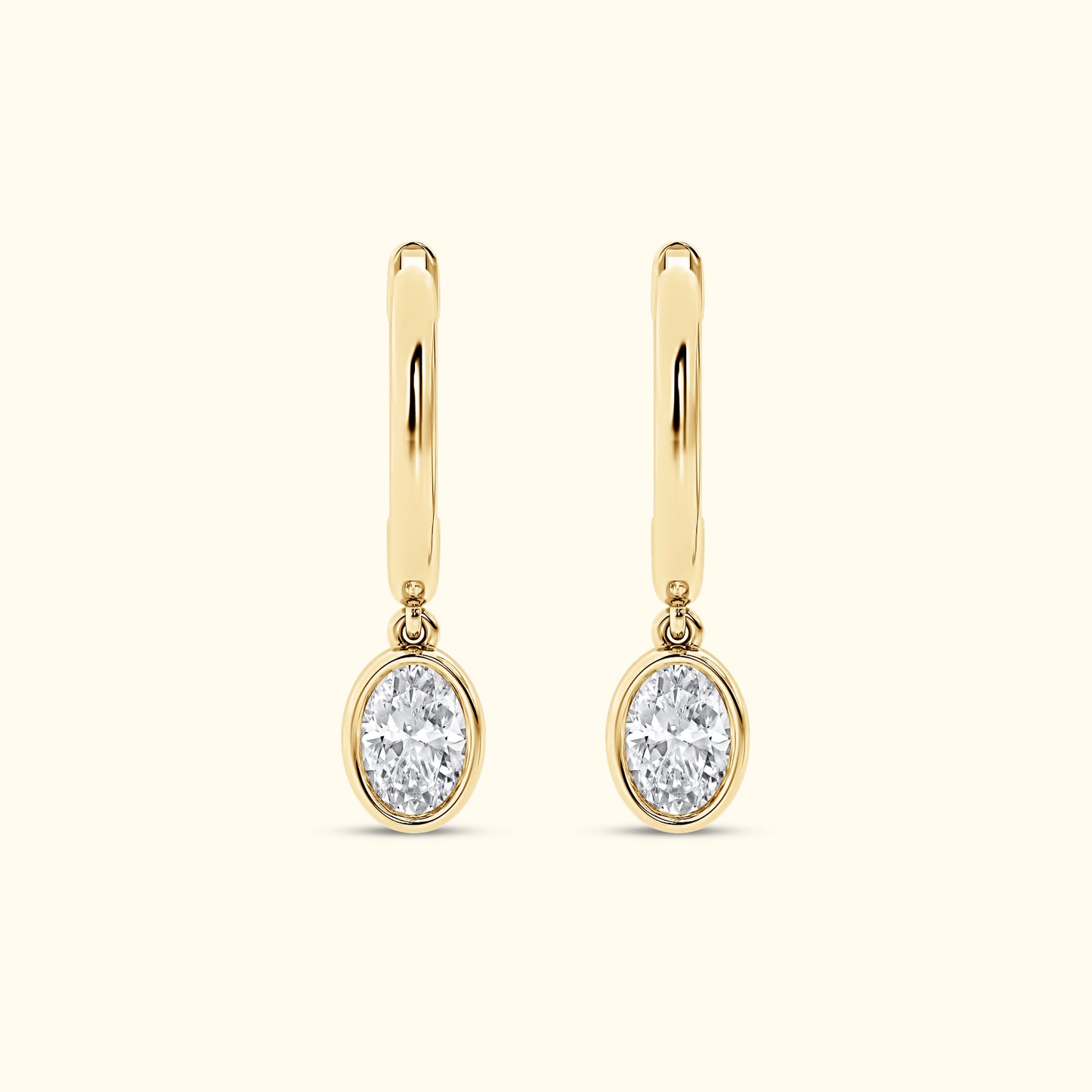 Yellow gold Huggie with a Bezel Set Oval Diamond Drop