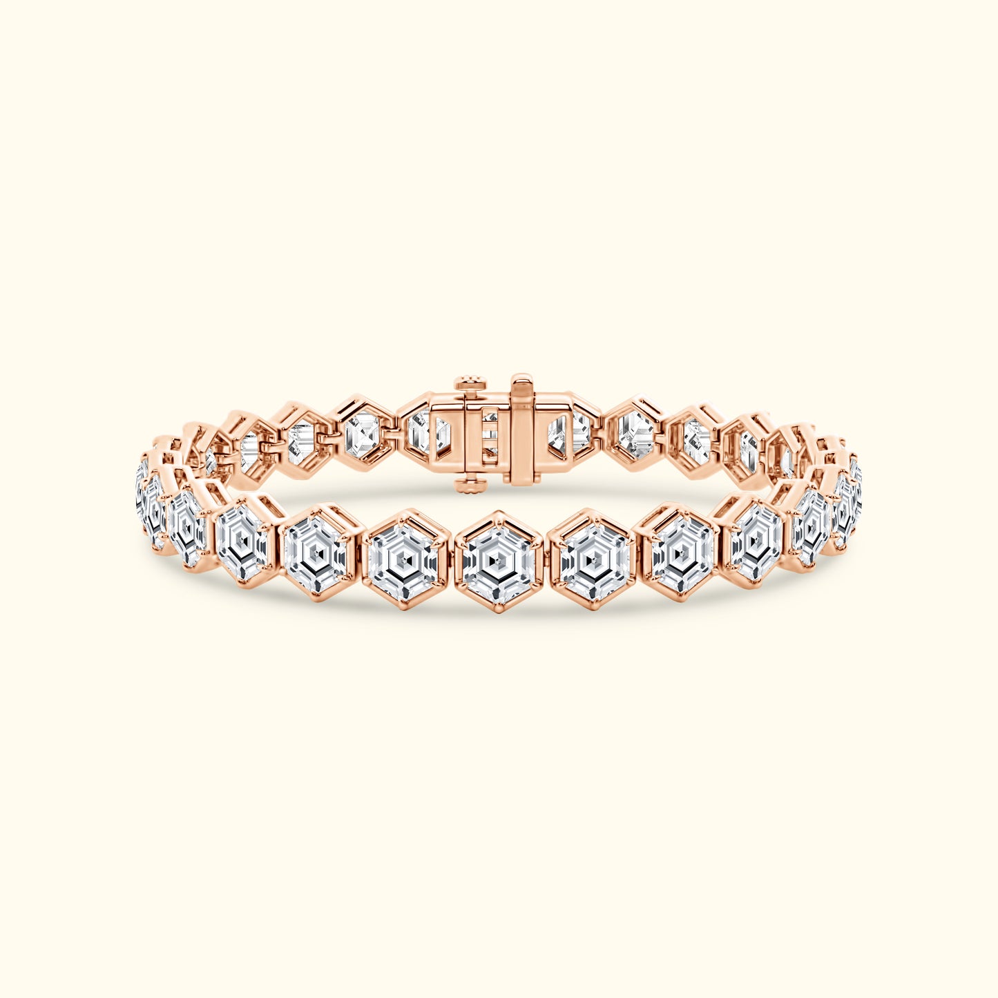 Rose gold bracelet with hexagonal links and clear gemstones.