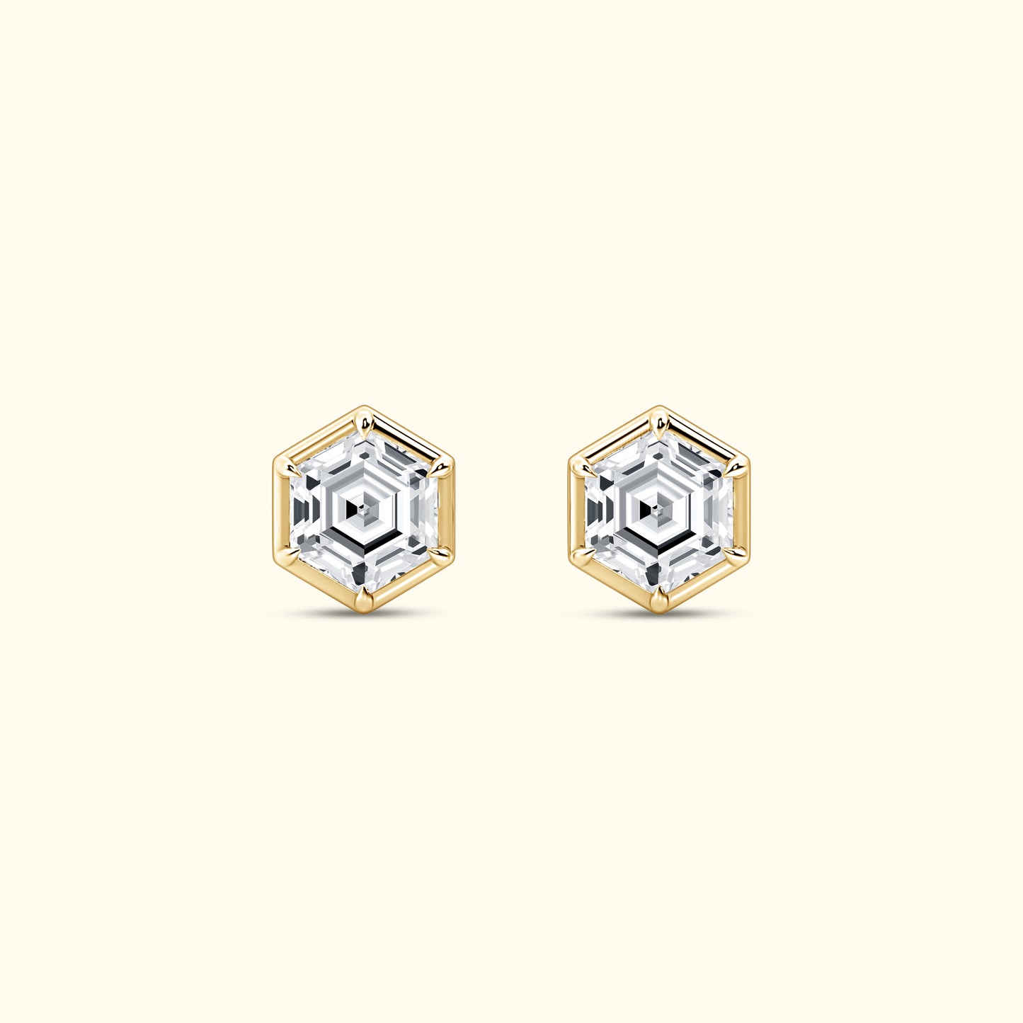 Hexagonal gold and silver earrings featuring sparkling clear gemstones.